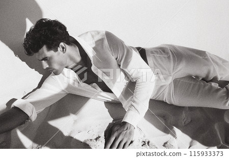 Man by the beach in Greece 115933373