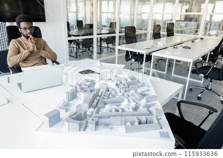 African american young man working in the office and looking busy 115933636