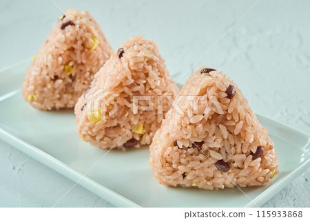 Japanese red rice balls on a white plate Japanese red rice balls on a white plate 115933868