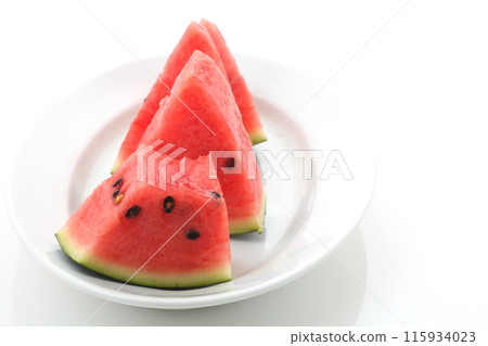 Half-eaten triangular cut of black watermelon 115934023