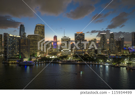 Night urban landscape of downtown district of Miami Brickell in Florida, USA. Skyline with brightly illuminated high skyscraper buildings in modern american megapolis 115934499