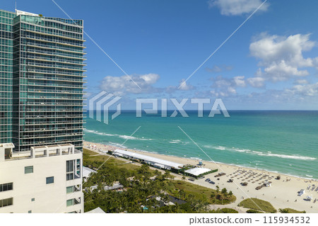 Panoramic view of Miami Beach urban landscape. South Beach high luxurious hotels and apartment buildings Panoramic view of Miami Beach urban landscape. South Beach high luxurious hotels and apartment buildings 115934532