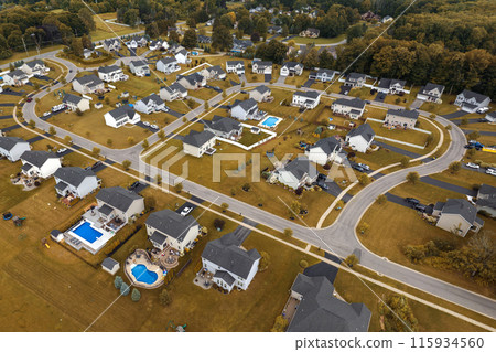 American dream homes as example of real estate development in US suburbs. View from above of residential houses in living area in Rochester, NY American dream homes as example of real estate development in US suburbs. View from above of residential houses in living area in Rochester, NY 115934560