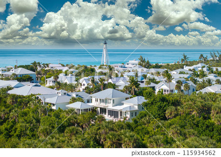 Wealthy waterfront residential area. Rich neighborhood with expensive vacation homes and white lighthouse in Boca Grande, small town on Gasparilla Island in southwest Florida 115934562