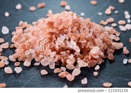 Pink salt and black background Pink salt and black background 115935230