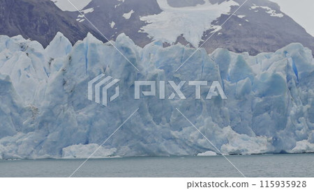 Glacial Majesty: Kayaking at the Edge of a Frozen Glacier 115935928