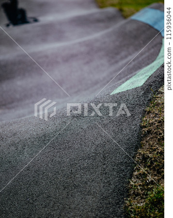Pump track close up. Waves of asphalt pump track outdoors. Pump track close up. Waves of asphalt pump track outdoors. 115936044