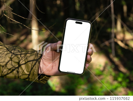 Lodz Poland June 01 2024 Hand holding mobile phone screen, smartphone mockup in nature, sunny day. Lodz Poland June 01 2024 Hand holding mobile phone screen, smartphone mockup in nature, sunny day. 115937082