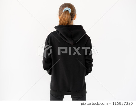 Back view of girl wearing black hoodie isolated on white background 115937380