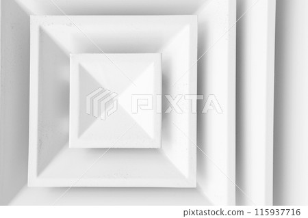 White ceiling ventilation grille with square diffusors, close-up White ceiling ventilation grille with square diffusors, close-up 115937716