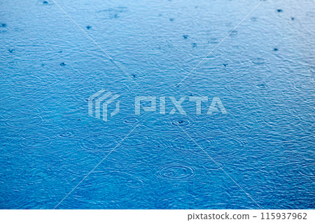 drops of water on the surface of the water in the pool 2 115937962