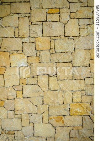 texture of a house wall made of real wild stone 115937999