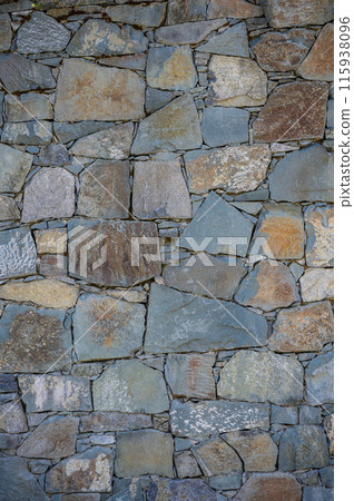 Old brick wall from a stone 115938096