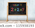 Simple math problem written on classroom blackboard 115938193