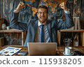 Joyful man celebrating at his desk 115938205