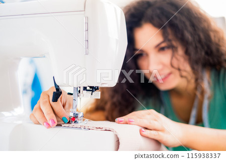 Close up view of sewing female hands Close up view of sewing female hands 115938337
