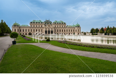 Vienna, Austria, August 18, 2022. Beautiful shot of the Belvedere Palace, a fairytale atmosphere with the gardens and the large fountain. Travel destinations. Vienna, Austria, August 18, 2022. Beautiful shot of the Belvedere Palace, a fairytale atmosphere with the gardens and the large fountain. Travel destinations. 115939538