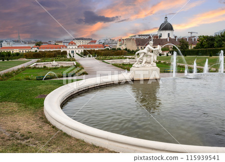 Vienna, Austria, August 18, 2022. Beautiful shot with a view of the gardens and fountain of the Belvedere Palace, a fairytale atmosphere. Travel destinations. No people. Vienna, Austria, August 18, 2022. Beautiful shot with a view of the gardens and fountain of the Belvedere Palace, a fairytale atmosphere. Travel destinations. No people. 115939541