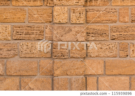 Sand brick blocks shell limestone wall texture background vintage retro color backdrop 115939896