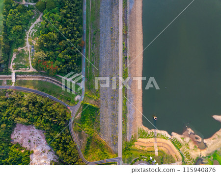 Top down of Dam lake mountains with forest green pattern, Beautiful light sunset or sunrise weather, Drone shot aerial view irrigation Nature environment 115940876