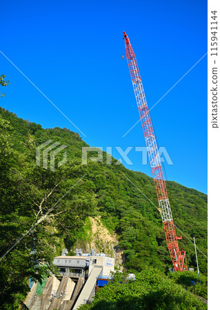Aimata Dam under construction, Crane tower in the mountains, Sarugakyo, Season of fresh greenery Aimata Dam under construction, Crane tower in the mountains, Sarugakyo, Season of fresh greenery 115941144