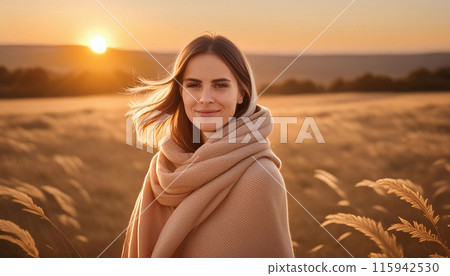 Female wrapped blanket field sunset 115942530