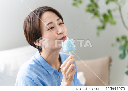 Young woman eating ice cream lifestyle image Young woman eating ice cream lifestyle image 115943073