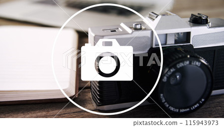 Image of camera icon over camera on desk Image of camera icon over camera on desk 115943973