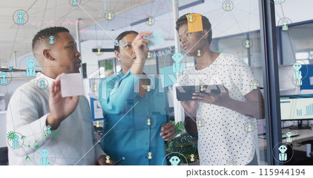 Image of connected profile icons over african american colleagues discussing over sticky notes 115944194