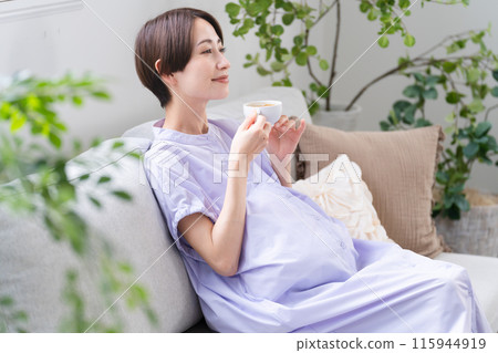 Pregnant woman drinking decaffeinated coffee Lifestyle image 115944919