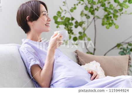 Pregnant woman drinking decaffeinated coffee Lifestyle image 115944924