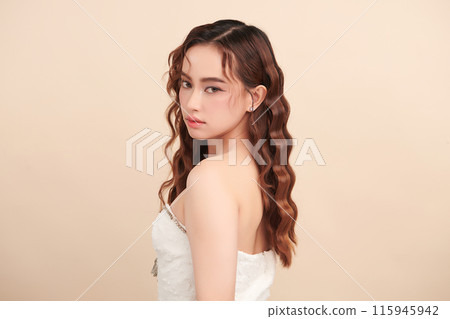 Beautiful young asian woman with clean fresh skin on beige background, Face care, Facial treatment, Cosmetology, beauty and spa, Asian women portrait. 115945942