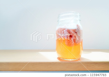 Homemade natural fruit yeast made from strawberries with bubbles venting on a white background Homemade natural fruit yeast made from strawberries with bubbles venting on a white background 115947783