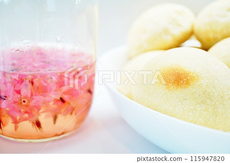 Handmade bread fermented with natural flower yeast from the discolored pink borage on a white background 115947820