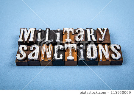 MILITARY SANCTIONS. Wooden alphabet letter blocks on blue textured background MILITARY SANCTIONS. Wooden alphabet letter blocks on blue textured background 115950069