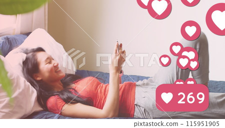 Image of media icons over happy asian woman using smartphone 115951905