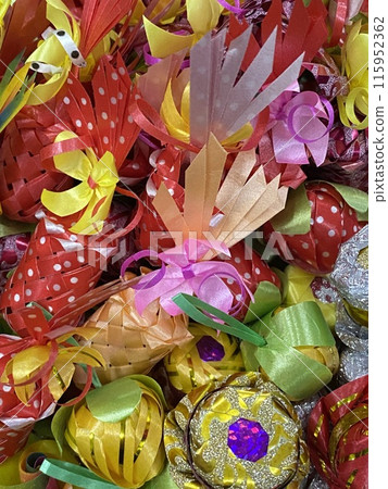 Colorful Christmas ornaments in the form of ribbons and bows Colorful Christmas ornaments in the form of ribbons and bows 115952362