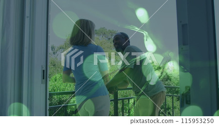 Image of light spots over senior diverse couple 115953250