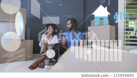 Image of data processing over diverse couple moving house 115954893