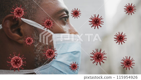 Image of covid 19 cells over african american man wearing face mask 115954926