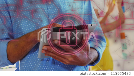 Image of security padlock and connections over biracial businessman using tablet in office Image of security padlock and connections over biracial businessman using tablet in office 115955483