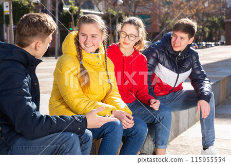 Teenagers are communicating on walk in the city 115955554