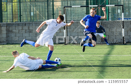 Junior football teams having scrimmage Junior football teams having scrimmage 115955557