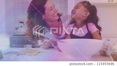 Image of lights over happy caucasisan mother and daughter cooking together Image of lights over happy caucasisan mother and daughter cooking together 115955696