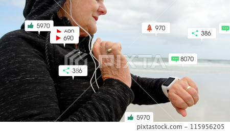 Image of notification bars over senior caucasian woman with headphone using smartwatch at beach Image of notification bars over senior caucasian woman with headphone using smartwatch at beach 115956205