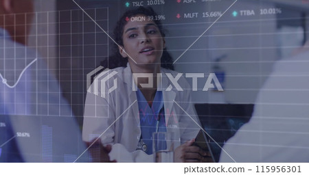 Image of multiple graphs and trading boards over diverse doctor discussing patient reports 115956301