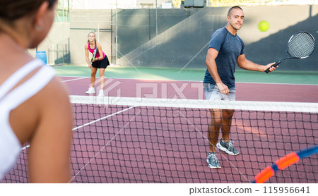 Focused young man playing friendly tennis match. Concept of concentration in competition 115956641