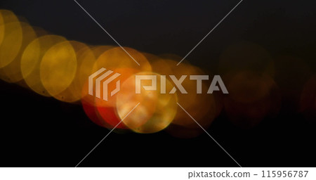 Image of moving spots of yellow light on black background 4k Image of moving spots of yellow light on black background 4k 115956787
