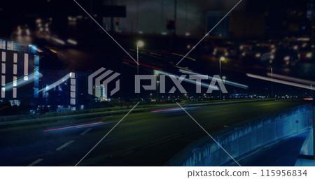 Image of road traffic in city at night in fast motion with city lights and light trails in the foreg Image of road traffic in city at night in fast motion with city lights and light trails in the foreg 115956834