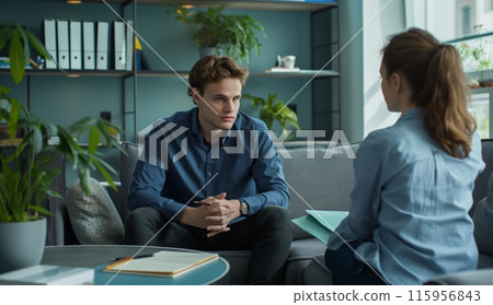 Man Listening To Woman On Couch 115956843